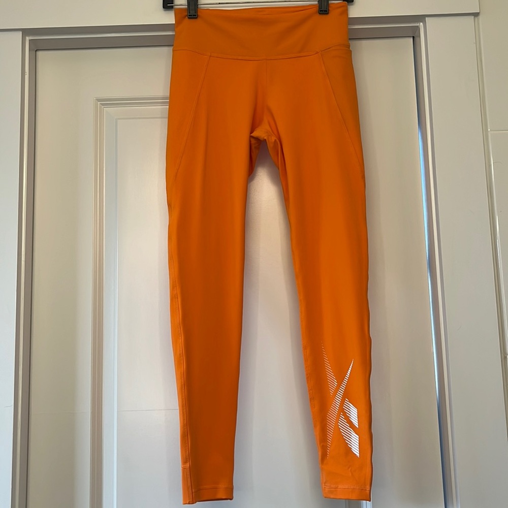 Womens Reebok orange athletic leggings